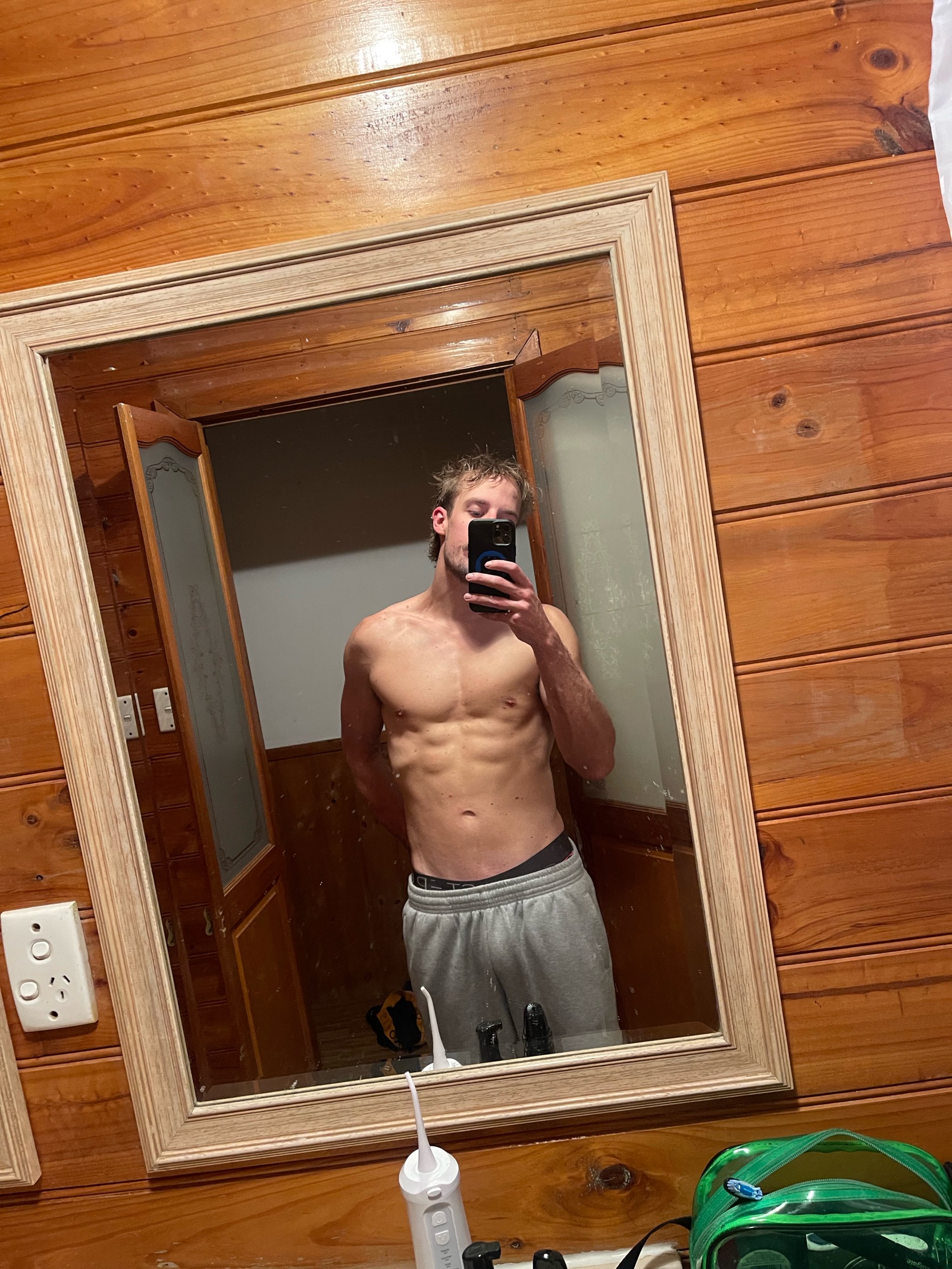 Elliot, lean with visible abs after coaching